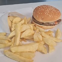 A T & D Ford burger with a portion of hand-cut chips.
