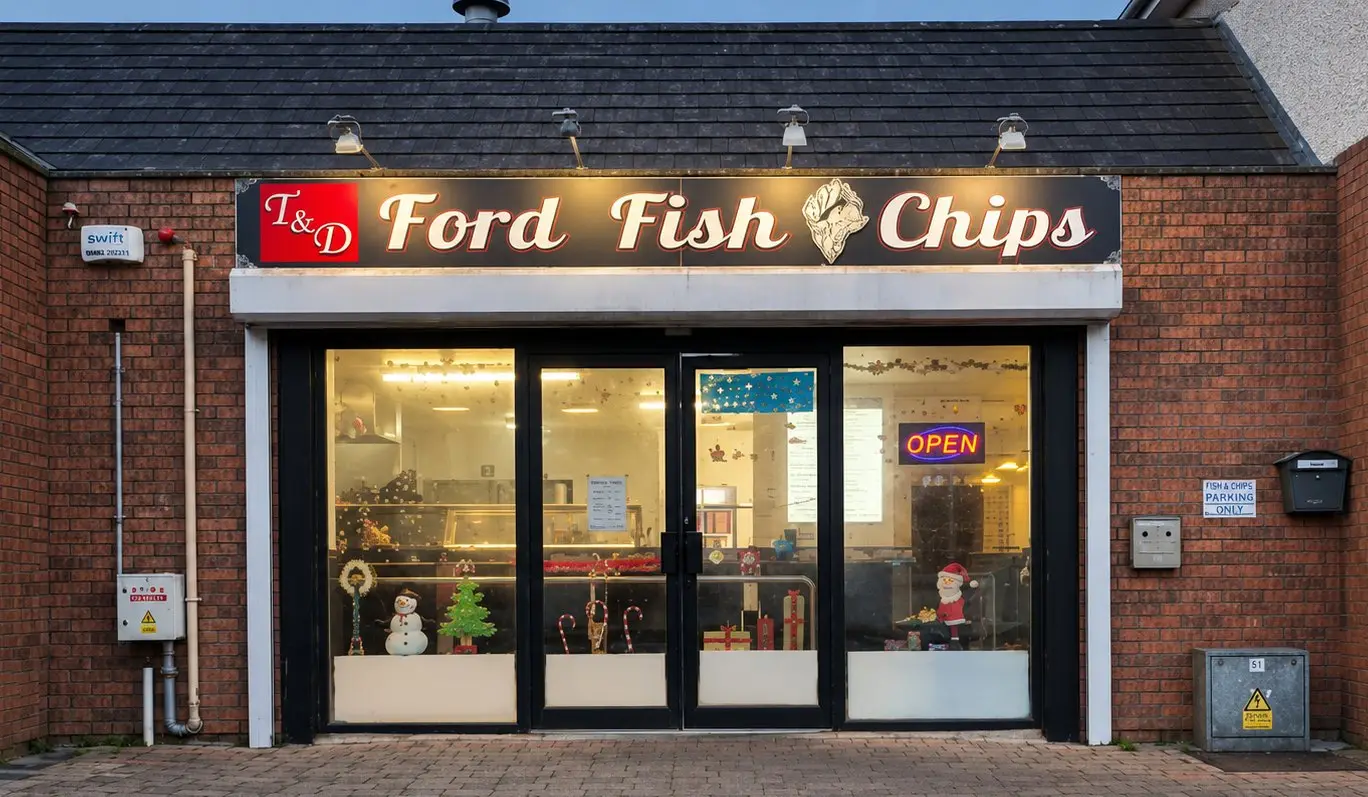 The lit T & D Ford Fish and Chips shopfront at Unit 2, Ballycummin Village.